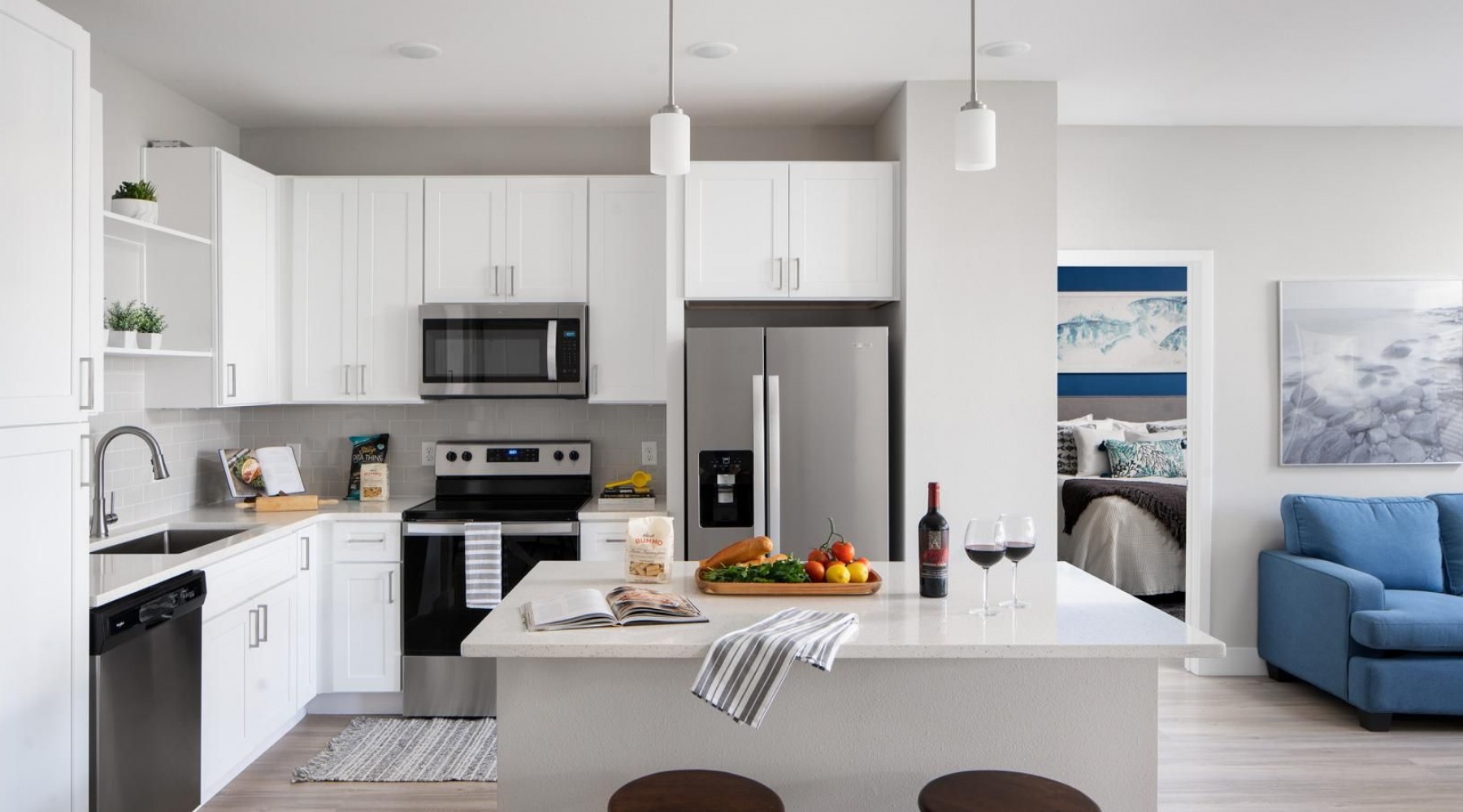 a kitchen with white cabinets