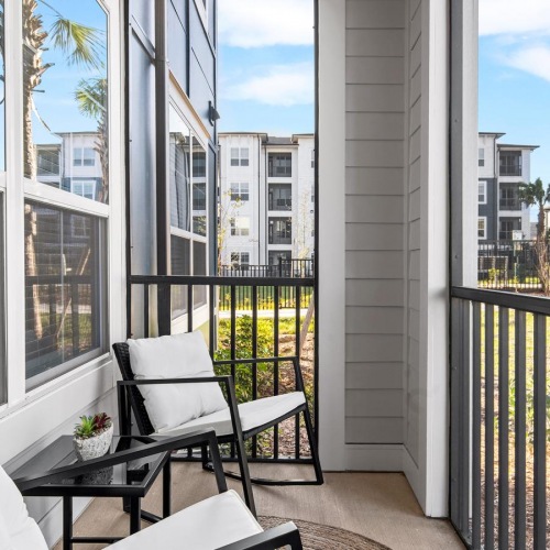 Generous balconies a balcony with a patio and chairs