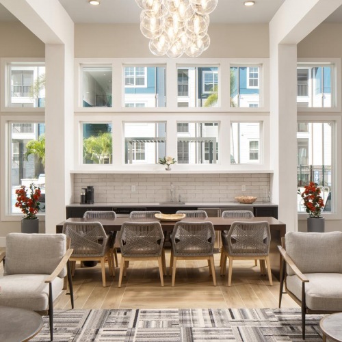 Vibrant community life with a variety of dining options a large room with a chandelier and chairs